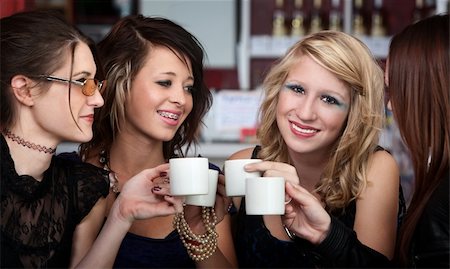 simsearch:400-04238163,k - Young Sexy teen friends having Coffee in a Restaurant Stock Photo - Budget Royalty-Free & Subscription, Code: 400-04775811