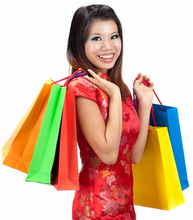 simsearch:400-06092781,k - Oriental woman in red Traditional Chinese Cheongsam with shopping bag Photographie de stock - Aubaine LD & Abonnement, Code: 400-04775921
