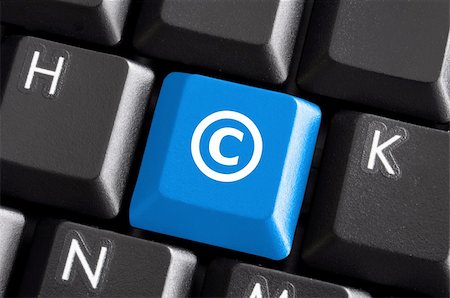 copyright concept with blue  button on computer keyboard Stock Photo - Budget Royalty-Free & Subscription, Code: 400-04775998