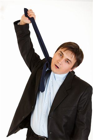 simsearch:400-05687698,k - Stressed businessman hanging himself on his necktie isolated on white Stock Photo - Budget Royalty-Free & Subscription, Code: 400-04778089