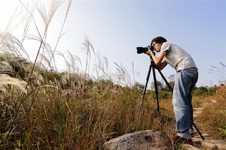 simsearch:400-04880707,k - Photographer taking photo Stock Photo - Budget Royalty-Free & Subscription, Code: 400-04778927