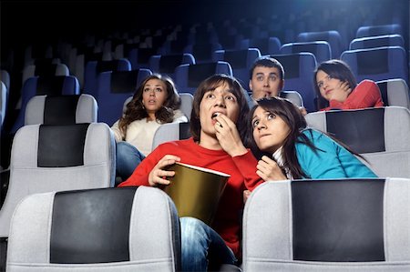 entertainment industry concepts - The scared young people at cinema viewing Stock Photo - Budget Royalty-Free & Subscription, Code: 400-04778977