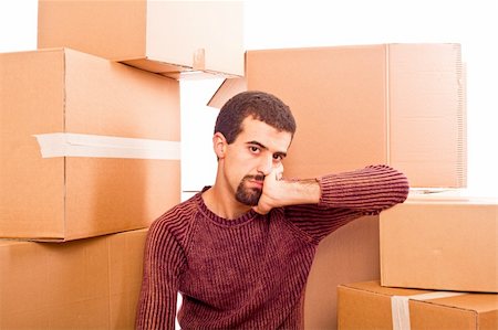 Stressed Young Man on Moving Swamped with Boxes Stock Photo - Budget Royalty-Free & Subscription, Code: 400-04779233