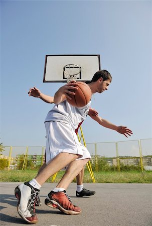 simsearch:400-04217948,k - streetball basketball game with two young player at early morning on city court Stock Photo - Budget Royalty-Free & Subscription, Code: 400-04779426