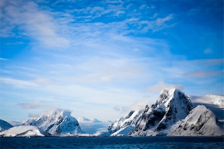 Beautiful snow-capped mountains against the blue sky in Antarctica Stock Photo - Budget Royalty-Free & Subscription, Code: 400-04779461