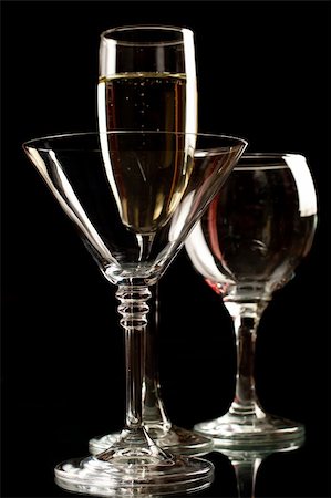 Champagne, wine and martini glasses isolated on black background Stock Photo - Budget Royalty-Free & Subscription, Code: 400-04779520