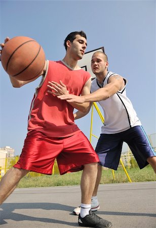 streetball basketball game with two young players at early morning on city court Stock Photo - Budget Royalty-Free & Subscription, Code: 400-04779598