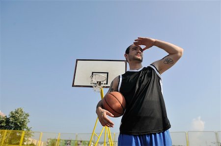 simsearch:400-04779709,k - basketball player practicing and posing for basketball and sports athlete concept Fotografie stock - Microstock e Abbonamento, Codice: 400-04779602