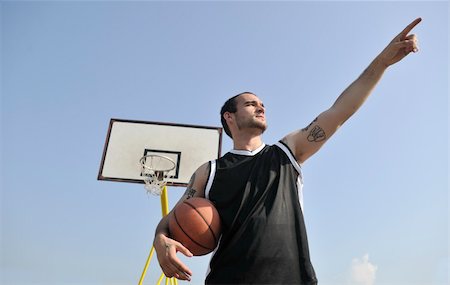 simsearch:400-04779709,k - basketball player practicing and posing for basketball and sports athlete concept Fotografie stock - Microstock e Abbonamento, Codice: 400-04779603