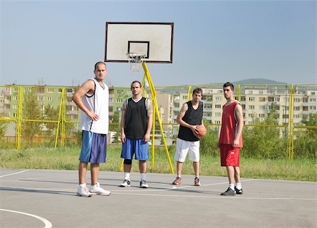 simsearch:400-03994929,k - basketball player team group  posing on streetbal court at the city on early morning Stockbilder - Microstock & Abonnement, Bildnummer: 400-04779677