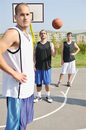 basketball player team group  posing on streetbal court at the city on early morning Stock Photo - Budget Royalty-Free & Subscription, Code: 400-04779688