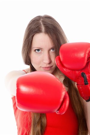 Woman wearing boxing gloves over white background Stock Photo - Budget Royalty-Free & Subscription, Code: 400-04779821