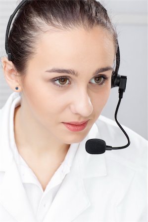 simsearch:400-03914864,k - woman with headset and close up shoot over white background Stock Photo - Budget Royalty-Free & Subscription, Code: 400-04779857