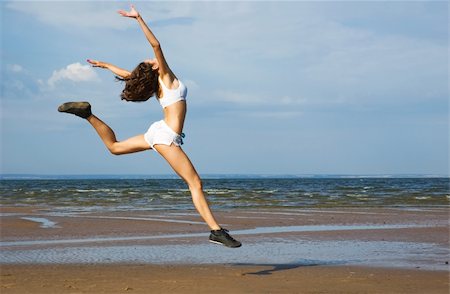 Young woman making exercise on the beach. Stock Photo - Budget Royalty-Free & Subscription, Code: 400-04770729
