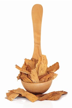 Astragalus root in an olive wood ladle and scattered, isolated over white background. Used extensively in chinese herbal medicine to speed healing and treat diabetes. Zhi huang qui. Astragali radix. Stock Photo - Budget Royalty-Free & Subscription, Code: 400-04771369