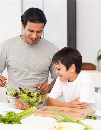 simsearch:400-04792006,k - Handsome man preparing a salad with his son in the kitchen Stock Photo - Budget Royalty-Free & Subscription, Code: 400-04772284