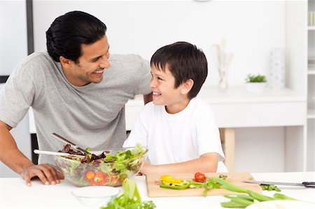 simsearch:400-04792006,k - Adorable father and son looking at each other in the kitchen at home Stock Photo - Budget Royalty-Free & Subscription, Code: 400-04772287