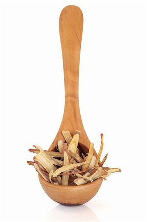 Licorice root herb used in chinese herbal medicine in an olive wood ladle isolated over white background. Focus on the licorice. Stock Photo - Budget Royalty-Free & Subscription, Code: 400-04772356