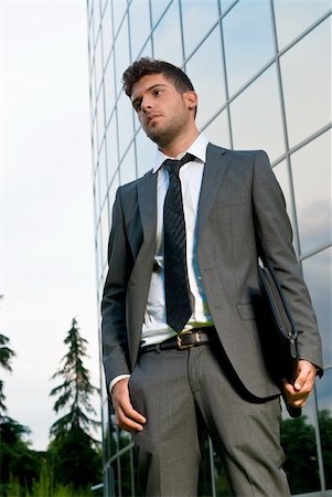simsearch:400-04631810,k - Young businessman looking to good future on modern building background Stock Photo - Budget Royalty-Free & Subscription, Code: 400-04772551
