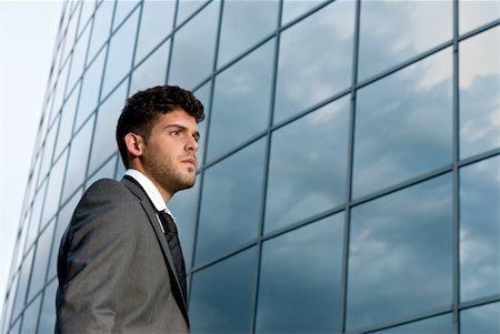 simsearch:400-08812456,k - Young businessman looking to good future on modern building background Stock Photo - Budget Royalty-Free & Subscription, Code: 400-04772553