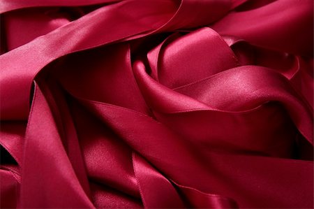 Red satin ribbons in a messy mess texture background Foto de stock - Royalty-Free Super Valor e Assinatura, Número: 400-04773241