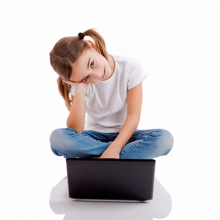 simsearch:400-04129482,k - Little girl sitting on floor working with a laptop Photographie de stock - Aubaine LD & Abonnement, Code: 400-04773563