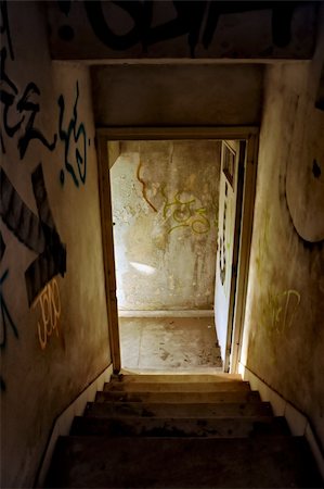 simsearch:400-05352419,k - Staircase and exit door of an abandoned house. Fotografie stock - Microstock e Abbonamento, Codice: 400-04773752
