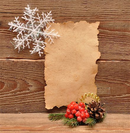christmas decoration and old paper on brown wood Fotografie stock - Microstock e Abbonamento, Codice: 400-04773786
