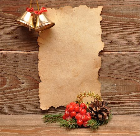 scrolled up paper - christmas decoration and old paper on brown wood texture Stock Photo - Budget Royalty-Free & Subscription, Code: 400-04773787