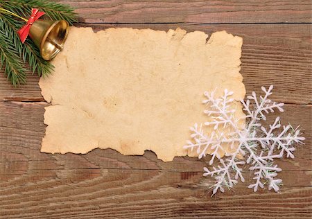 christmas decoration and old paper on brown wood texture Fotografie stock - Microstock e Abbonamento, Codice: 400-04773788