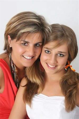 simsearch:400-04747810,k - Beautiful mother and daughter on a white background Stock Photo - Budget Royalty-Free & Subscription, Code: 400-04773780