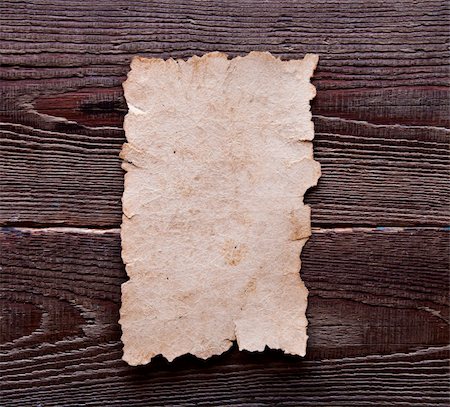 scrolled up paper - old paper on brown wood texture with natural patterns Stock Photo - Budget Royalty-Free & Subscription, Code: 400-04773790