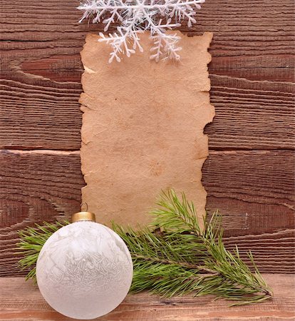 scrolled up paper - christmas decoration and old paper on brown wood texture Stock Photo - Budget Royalty-Free & Subscription, Code: 400-04773791