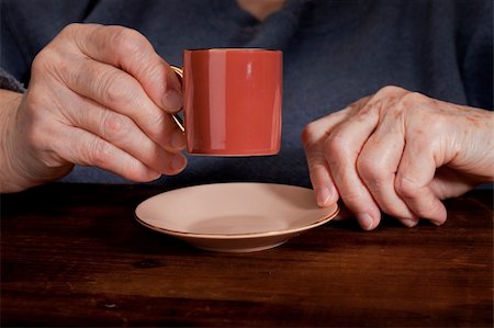 senior woman hands with espresso coffee cup against old grunge wooden table Stock Photo - Budget Royalty-Free & Subscription, Code: 400-04784443