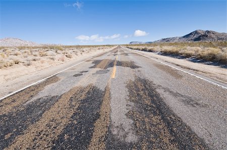 disorderly (artist) - Muddy road through a winter desert scene, Mojave National Preserve, California Foto de stock - Royalty-Free Super Valor e Assinatura, Número: 400-04784821