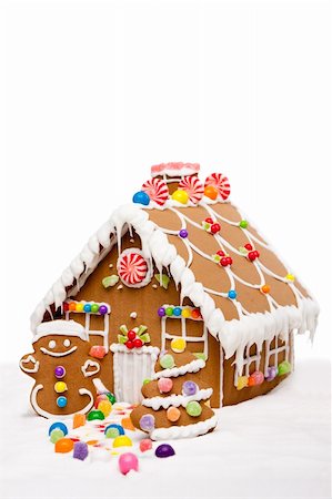 Gingerbread house, man and Christmas tree covered with snow and colorful candy on a winter landscape, isolated. Foto de stock - Super Valor sin royalties y Suscripción, Código: 400-04784869