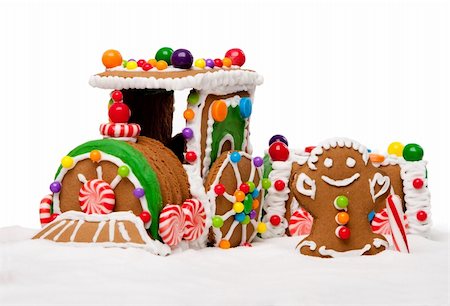 Gingerbread Polar Express Train and happy man for Christmas covered with snow and colorful candy on a winter landscape, isolated. Stock Photo - Budget Royalty-Free & Subscription, Code: 400-04784870