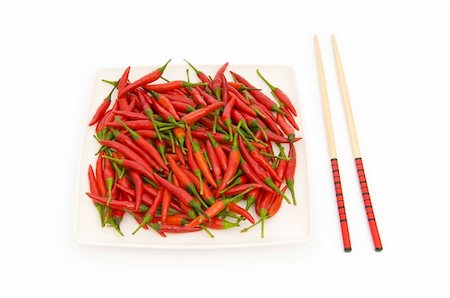 simsearch:400-04288181,k - Hot peppers with chopsticks and plate Photographie de stock - Aubaine LD & Abonnement, Code: 400-04784975