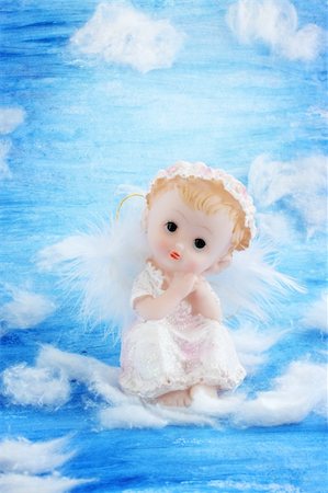 simsearch:400-04736001,k - Angel sitting on the white clouds in the sky Foto de stock - Super Valor sin royalties y Suscripción, Código: 400-04784983