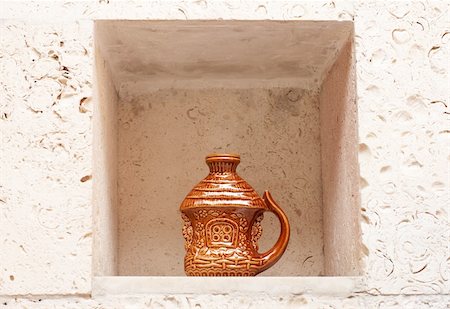 Decorative handmade earthenware in wall niche. Ukrainian culture. Stock Photo - Budget Royalty-Free & Subscription, Code: 400-04785063