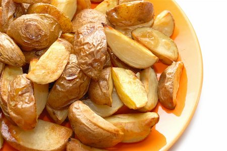 simsearch:400-04351737,k - Potatoes baked in their jackets on orange plate Stock Photo - Budget Royalty-Free & Subscription, Code: 400-04785089
