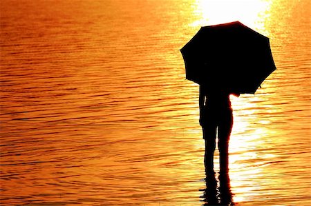 silhouette girl with umbrella - silhouette of young woman against summer sunset Stock Photo - Budget Royalty-Free & Subscription, Code: 400-04785647
