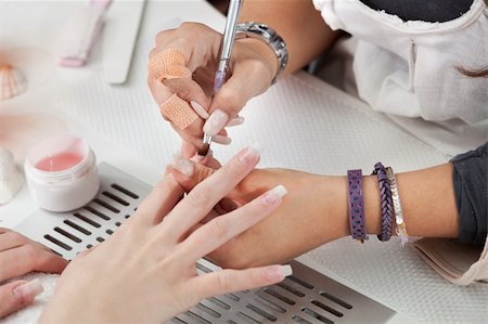 simsearch:600-03686255,k - Beautician applying gel on fingernails. Close-up shot Stock Photo - Budget Royalty-Free & Subscription, Code: 400-04785813