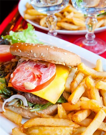 simsearch:400-05664697,k - Cheese burger - American cheese burger with fresh salad Stock Photo - Budget Royalty-Free & Subscription, Code: 400-04786208