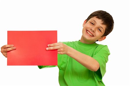 A laughing boy is holding a sheet of red papper; isolated on the white background Stock Photo - Budget Royalty-Free & Subscription, Code: 400-04786455