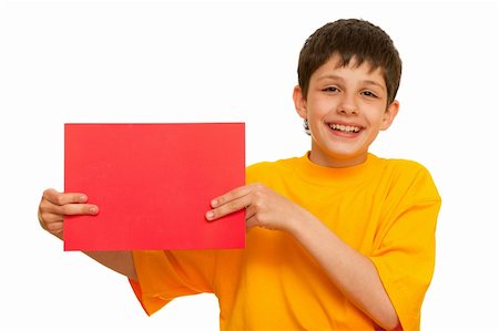 A boy in yellow  is holding a sheet of red papper; isolated on the white background Stock Photo - Budget Royalty-Free & Subscription, Code: 400-04786458