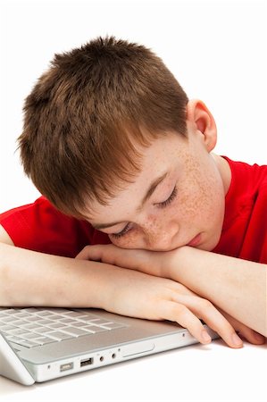 sleeping boy with a laptop on a white background Stock Photo - Budget Royalty-Free & Subscription, Code: 400-04786570