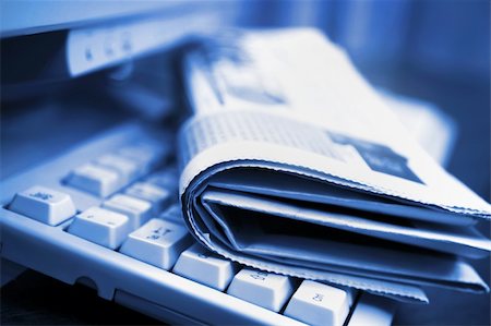 small and medium business - Newspapers on the computer keyboard close up Stock Photo - Budget Royalty-Free & Subscription, Code: 400-04786940