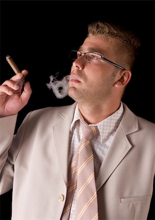 Businessman smoking cigar Stock Photo - Budget Royalty-Free & Subscription, Code: 400-04786994