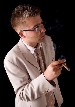 Businessman smoking cigar Stock Photo - Budget Royalty-Free & Subscription, Code: 400-04786997